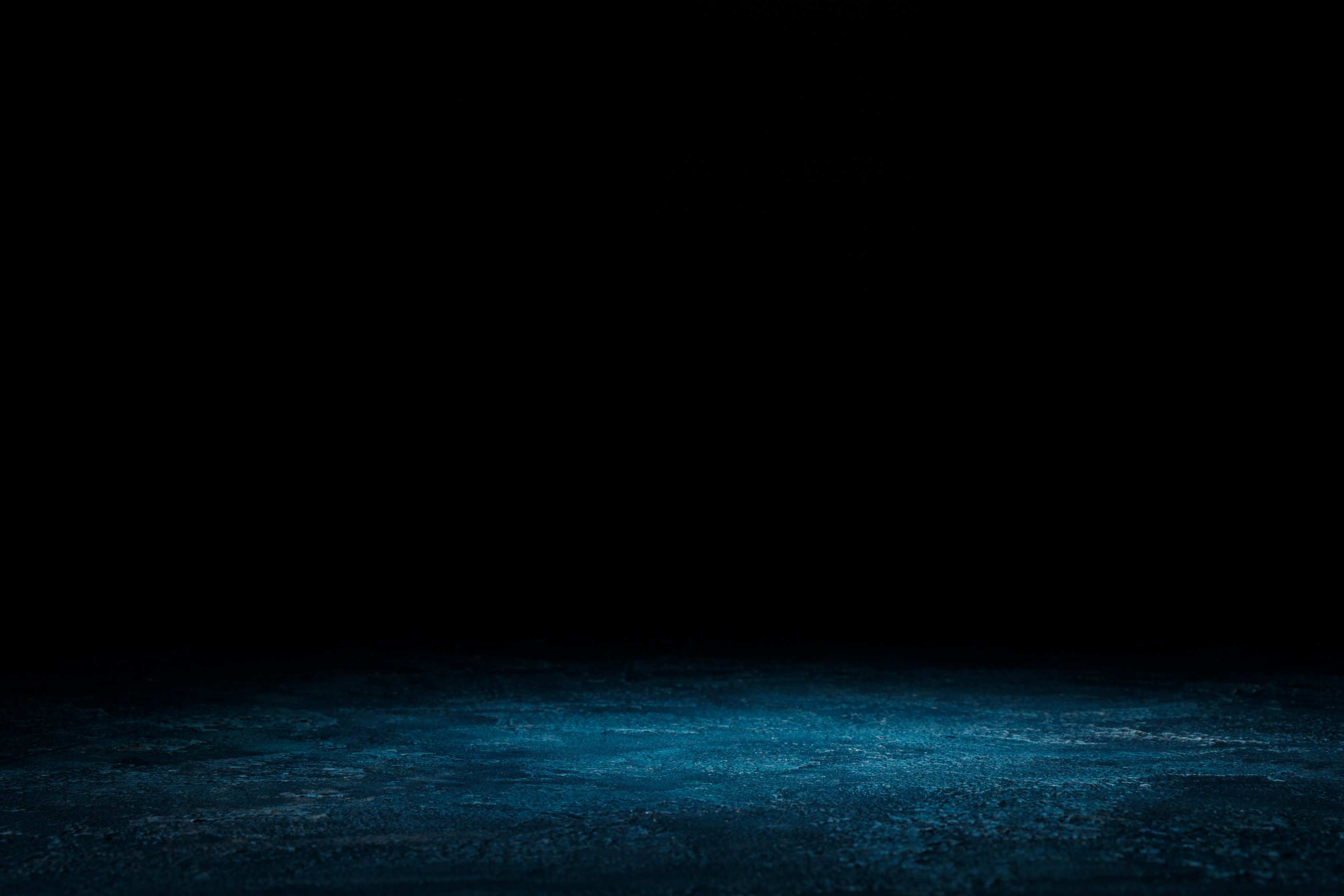 dark blue shabby wooden background on black